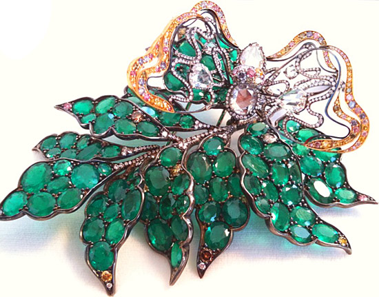Spectrum Best of Show: Emerald and diamond brooch by James Currens