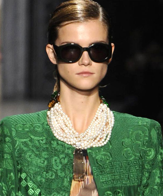 Multiple strands of pearls with pendant on the runway at Dries van Noten