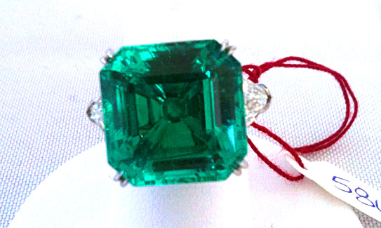 Classic rock: emerald and diamond ring by James Currens
