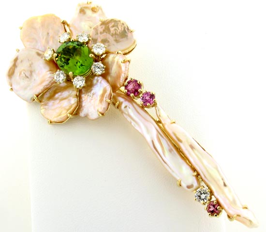 Flower brooch with keshi pearls, peridot, sapphires, and diamonds by Rex McClure