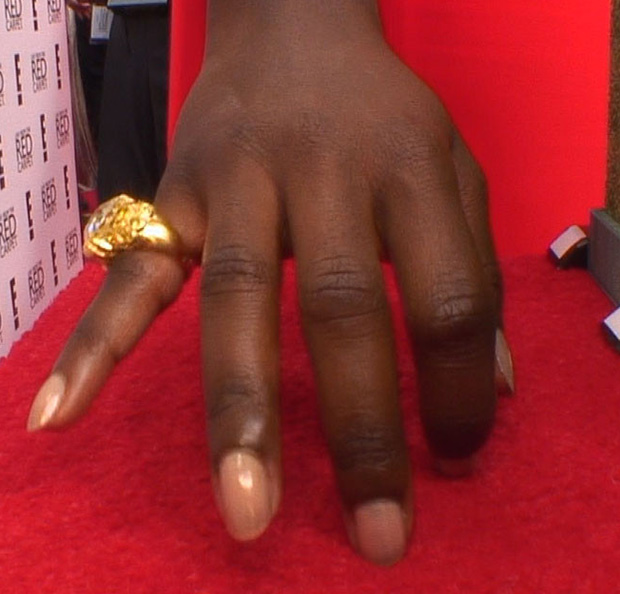 Lupita Nyong'o wears a Fred Leighton pinky ring on the E! Mani-cam