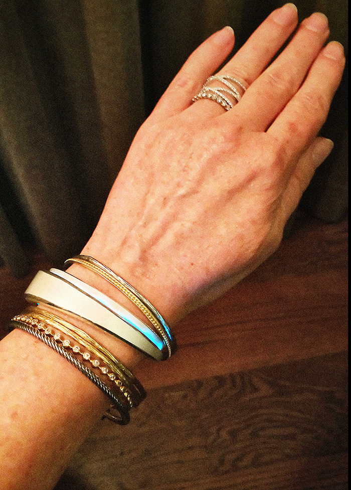 Cheryl Kremkow stacks the Beacon & Lively cuff with other bracelets.