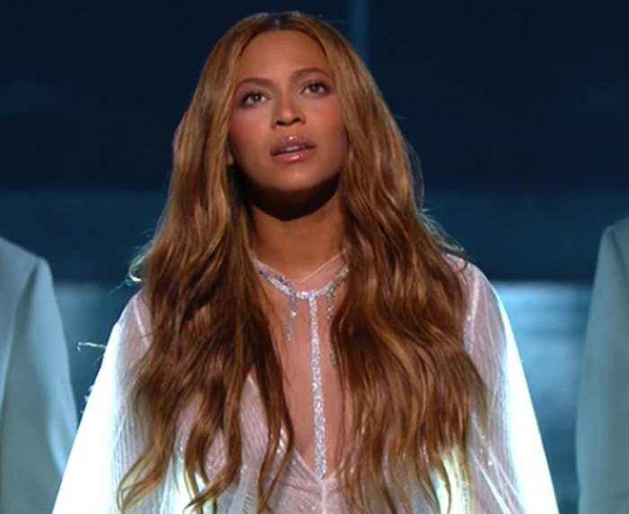 Beyonce performs wearing Lorraine Schwartz jewelry at the 2015 Grammy Awards