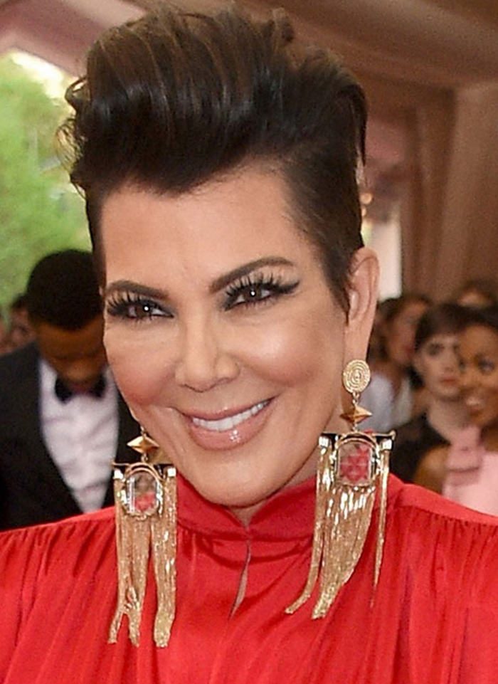Kris Jenner wears heavy fringe earrings to the 2015 Met Gala
