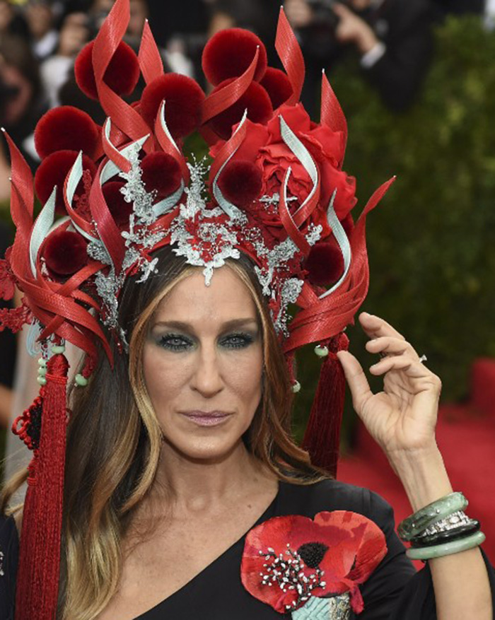 Sarah Jessica Parker in a Philip Treacy headdress and bangles by Jennifer Fisher at the 2015 Met Gala