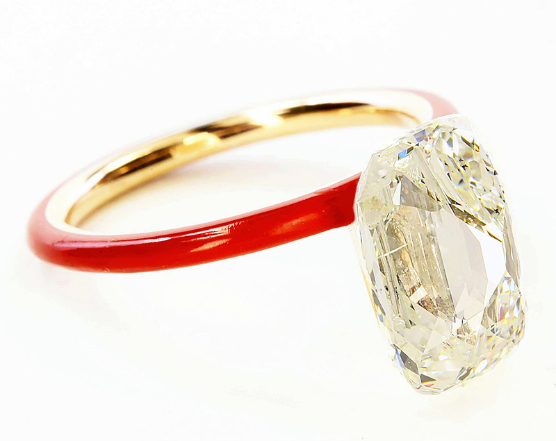 Floating diamond on a red ceramic band by James de Givenchy for Taffin