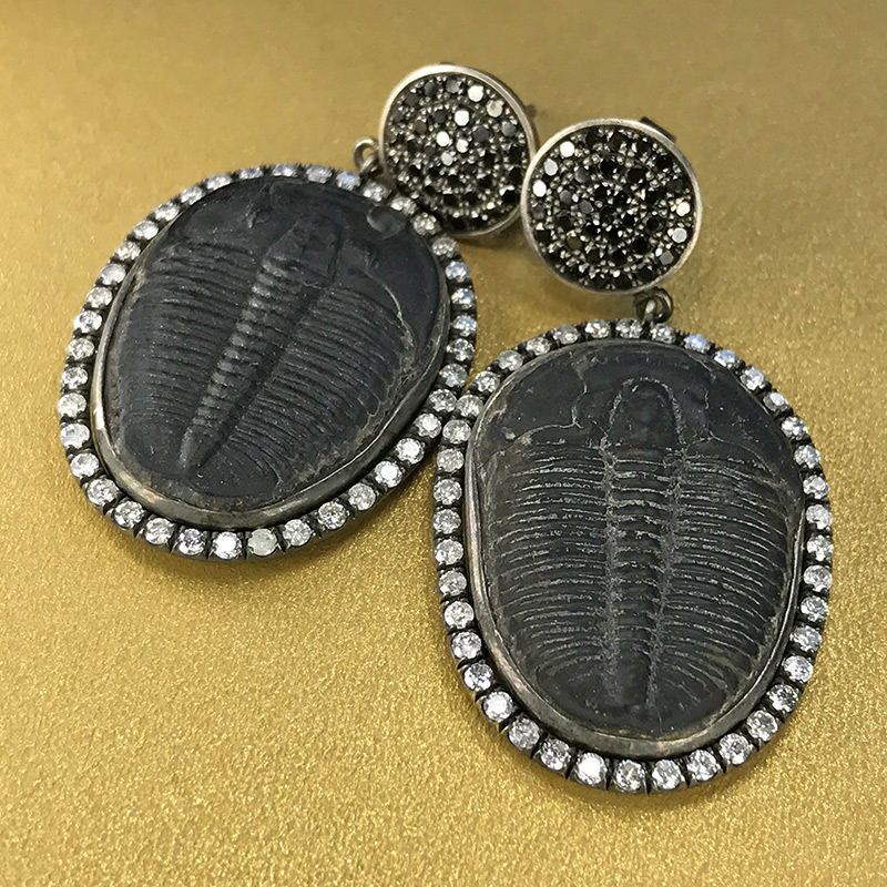 Fossil earrings by Feral Jewelry, photo by @kremkow