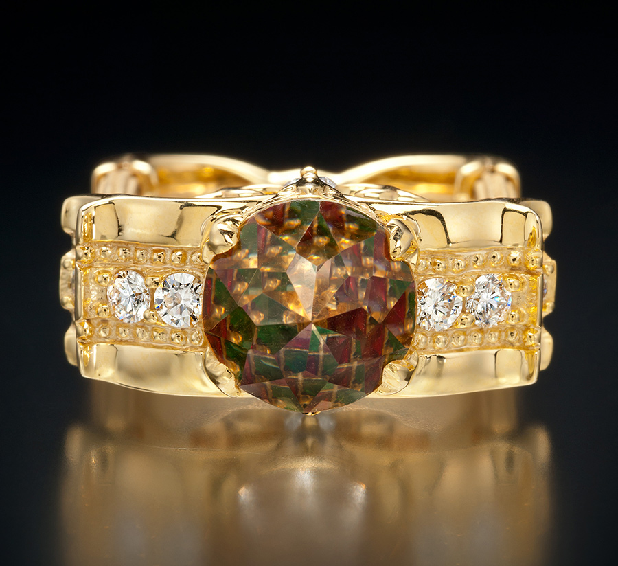 Davinchi Cut gem that reflects the colors of gems set underneath it like a kaleidoscope