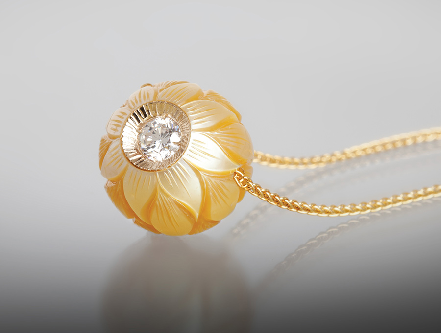 Diamond in a Pearl by Galatea, featuring a carved South Sea Cultured Pearl