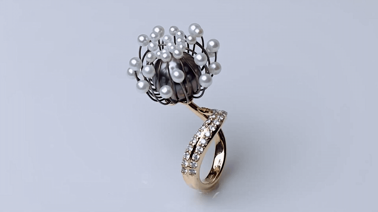 The Blossom Ring by Galatea Jewelry by Artist moves in response to heat.